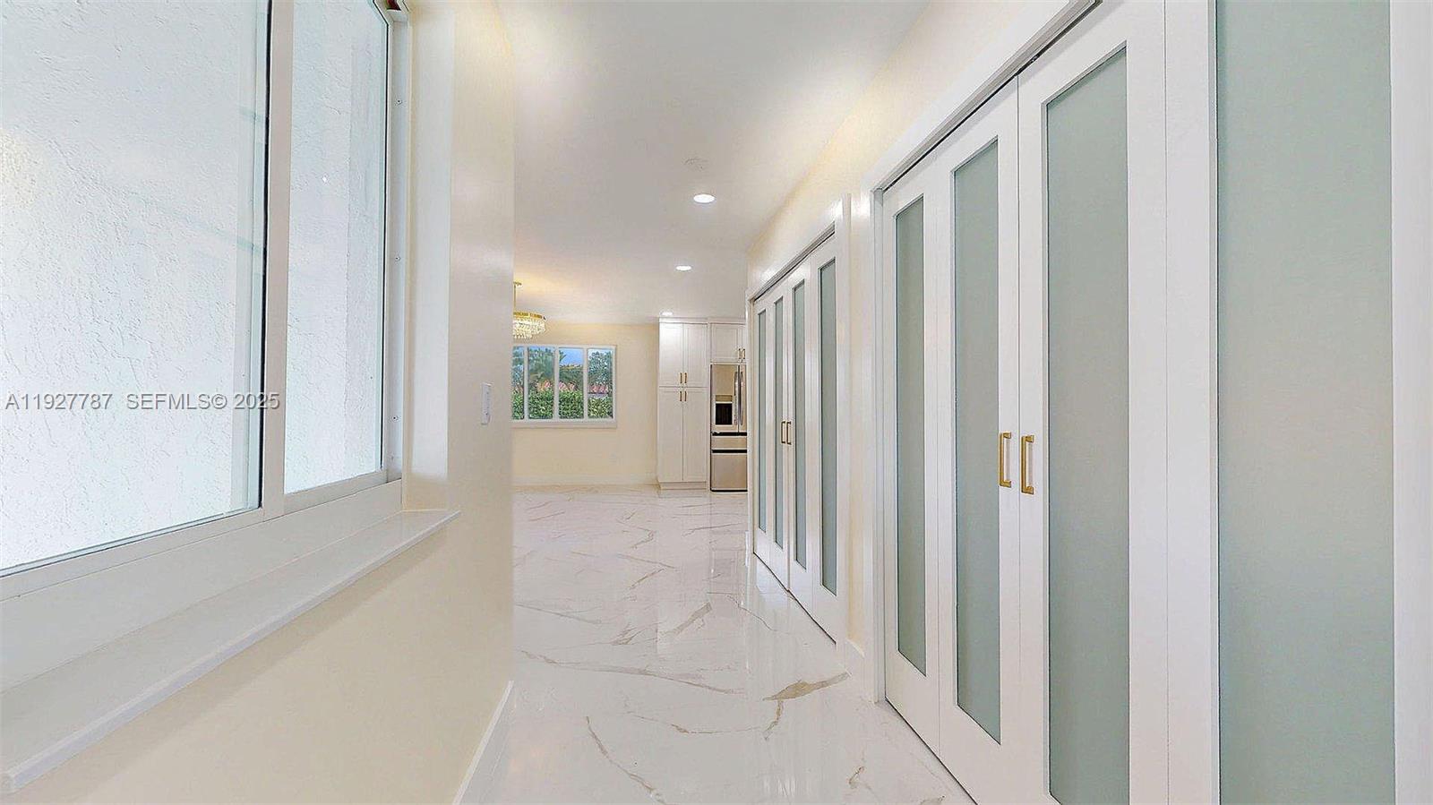 3801 Southwest 132nd Avenue Miami, FL 33175 - Photo 14 of 74 a view of a hallway with wooden floor and windows