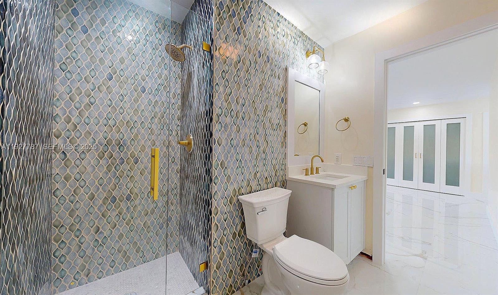 3801 Southwest 132nd Avenue Miami, FL 33175 - Photo 32 of 74 a white toilet sitting next to a shower curtain