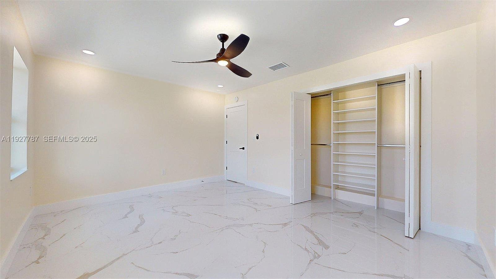 3801 Southwest 132nd Avenue Miami, FL 33175 - Photo 36 of 74 an empty room with closet and windows