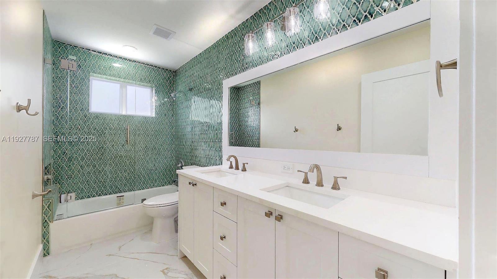 3801 Southwest 132nd Avenue Miami, FL 33175 - Photo 37 of 74 a bathroom with a sink a toilet and shower