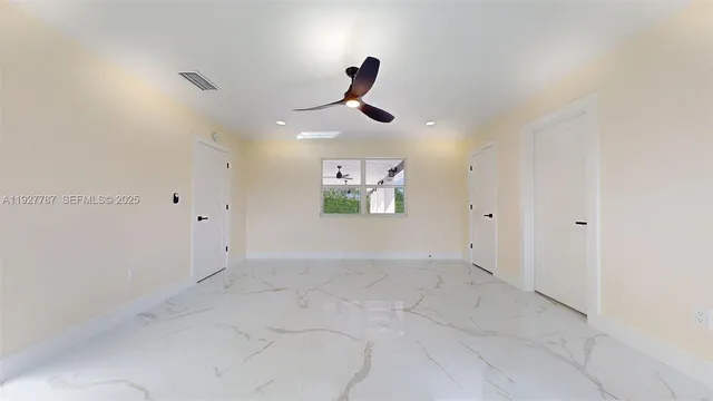 a bathroom with a glass door shower and a sink