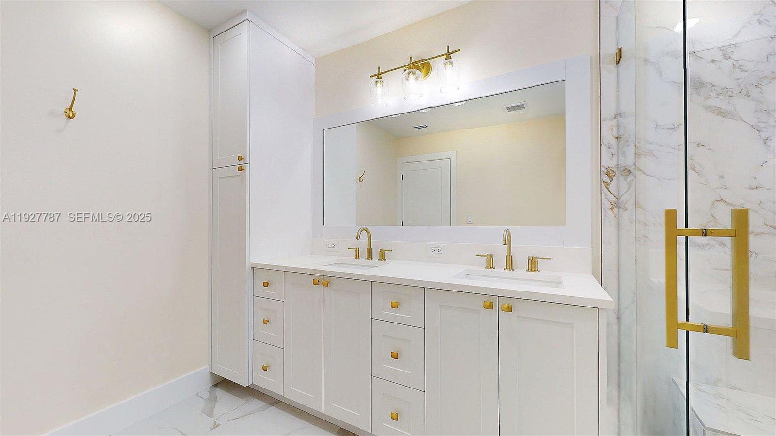 3801 Southwest 132nd Avenue Miami, FL 33175 - Photo 44 of 74 a bathroom with a double vanity sink and mirror