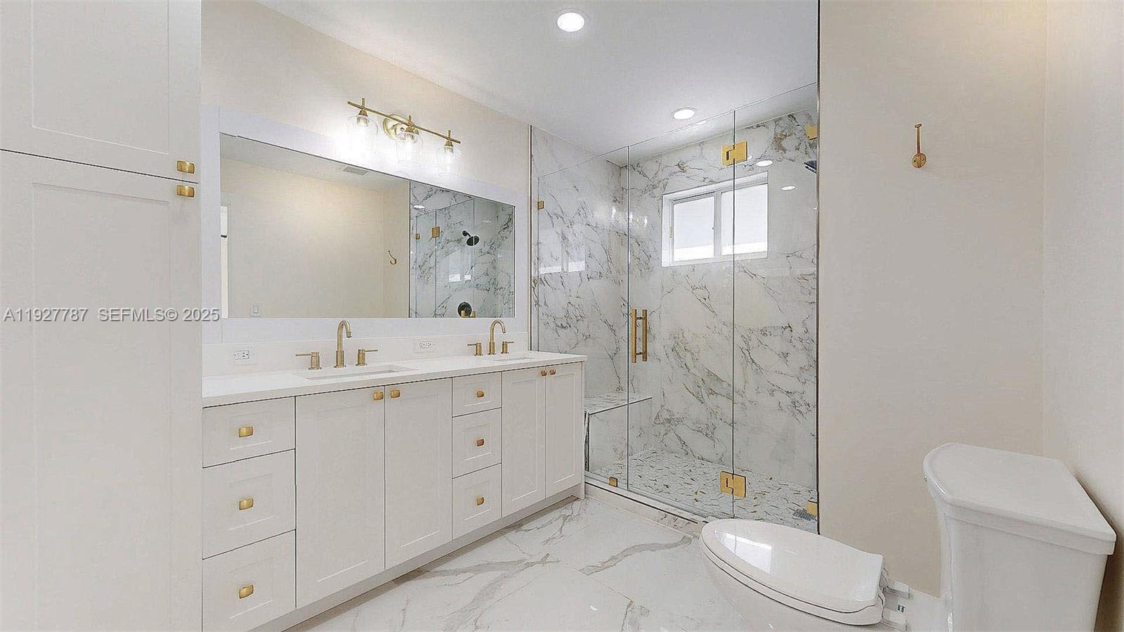 3801 Southwest 132nd Avenue Miami, FL 33175 - Photo 45 of 74 a spacious bathroom with a double vanity sink toilet and shower