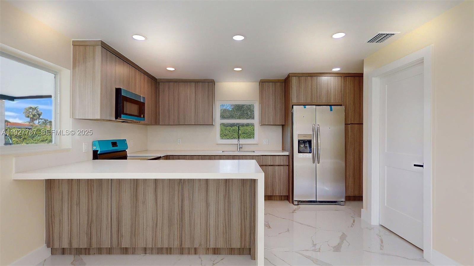 3801 Southwest 132nd Avenue Miami, FL 33175 - Photo 54 of 74 a kitchen with refrigerator and microwave