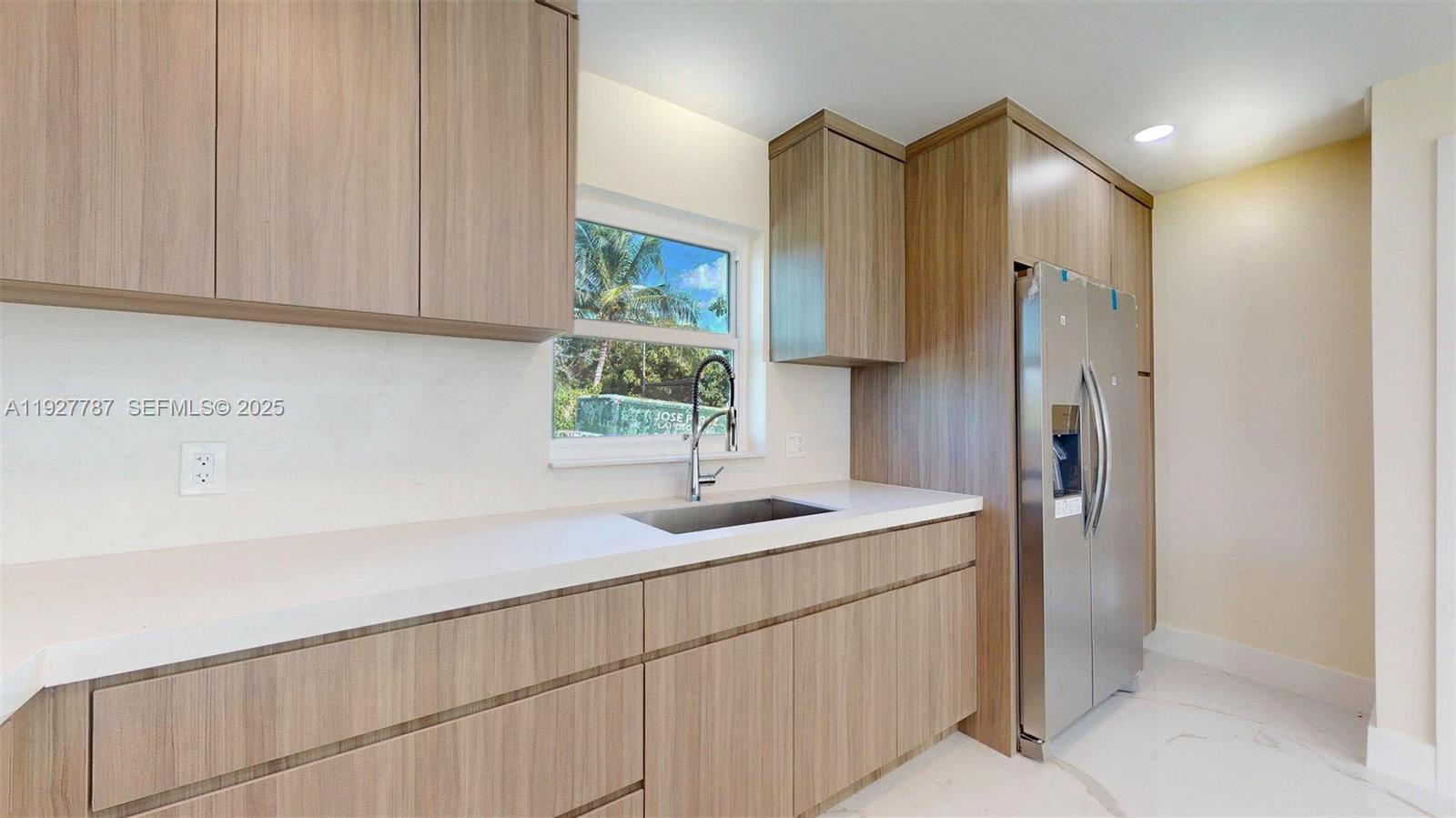 3801 Southwest 132nd Avenue Miami, FL 33175 - Photo 56 of 74 a bathroom with a sink and a mirror