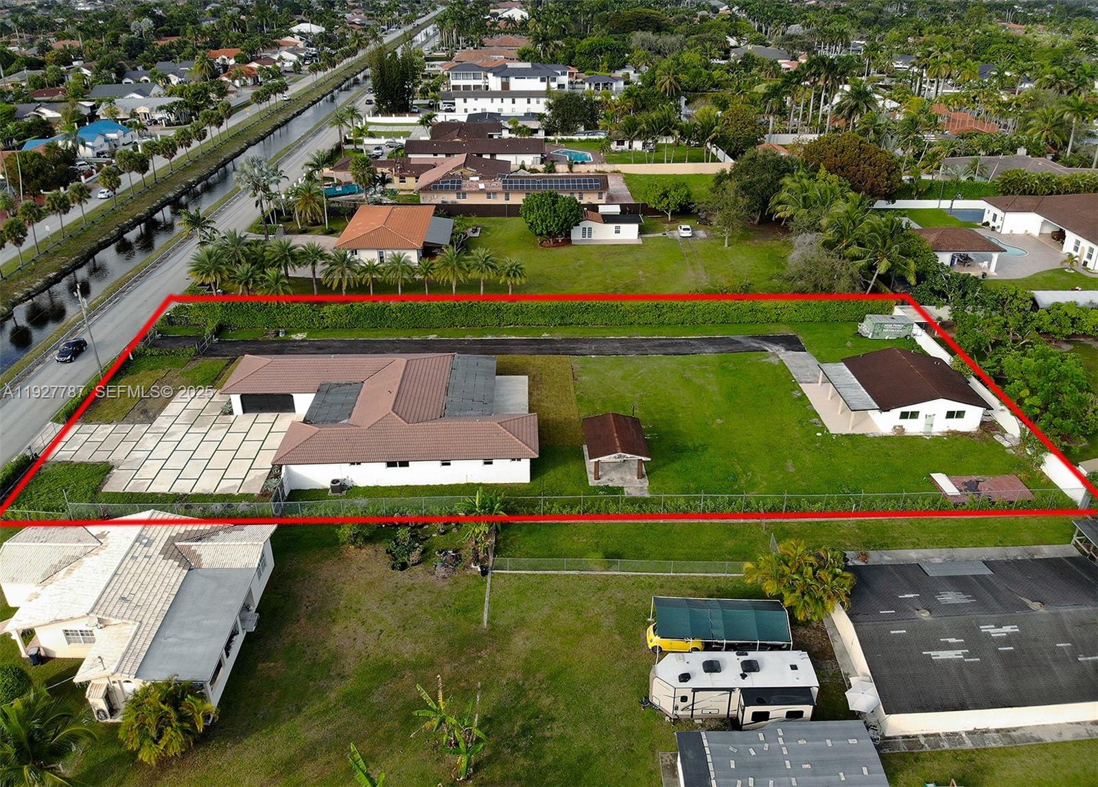 3801 Southwest 132nd Avenue Miami, FL 33175 - Photo 63 of 74 an aerial view of a tennis ground and a cars park side of the road