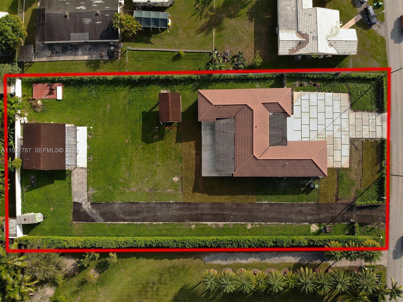 3801 Southwest 132nd Avenue Miami, FL 33175 - Photo 65 of 74 a front view of a house with a yard and a fountain