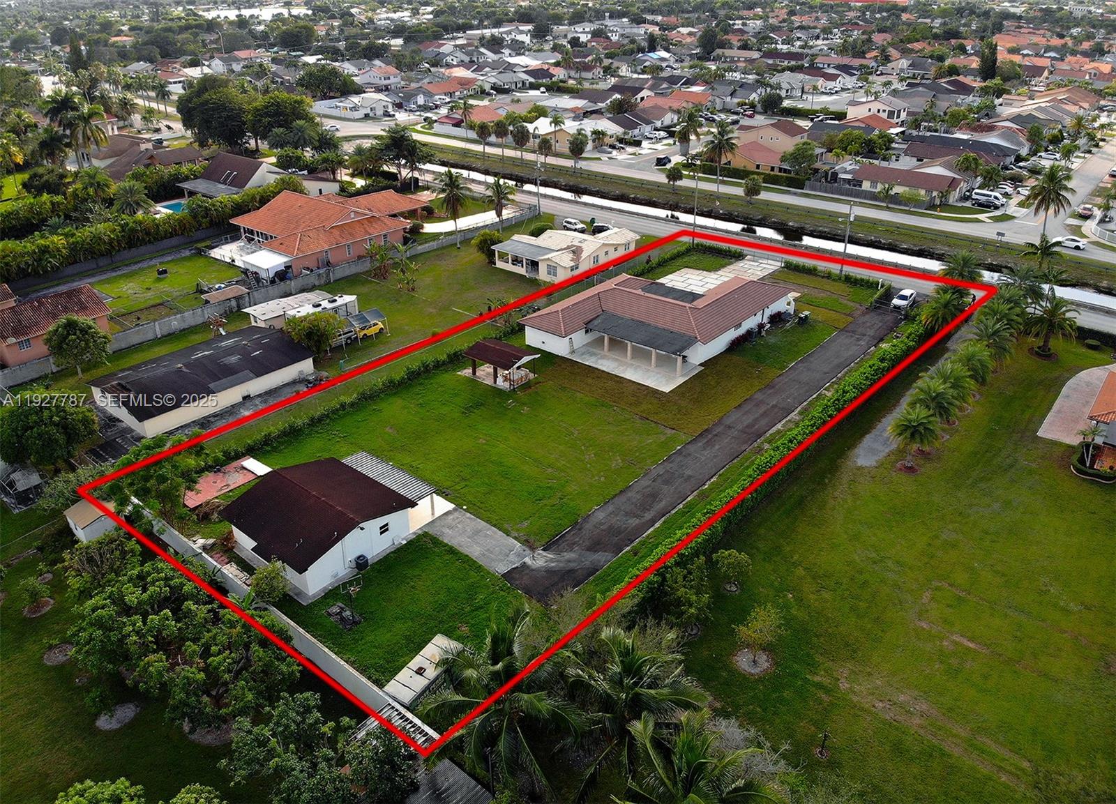 3801 Southwest 132nd Avenue Miami, FL 33175 - Photo 68 of 74 an aerial view of a tennis ground and a cars park side of the road