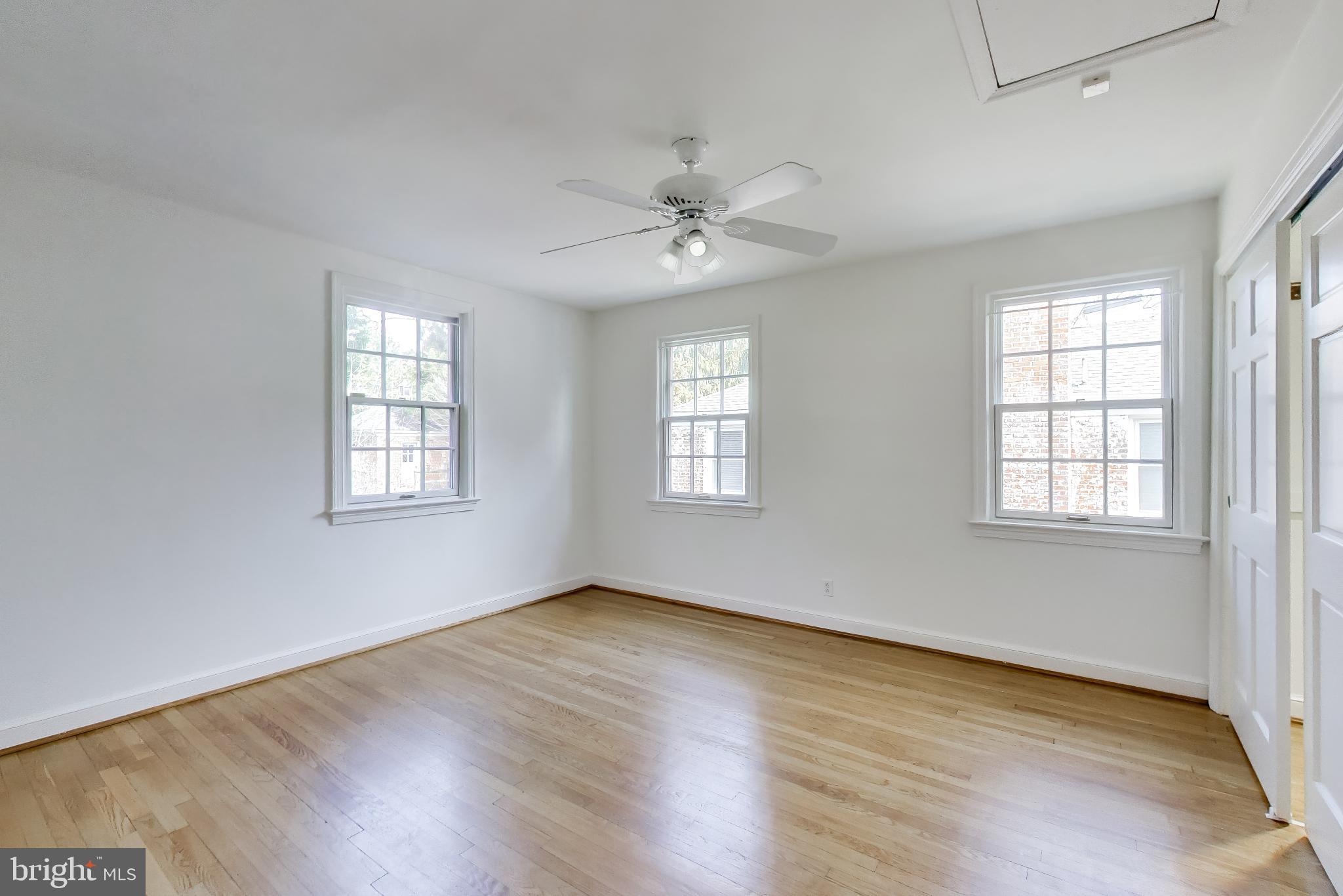 5138 Nebraska Avenue Northwest Washington, DC 20008 - Photo 19 of 39 wooden floor in an empty room with a window