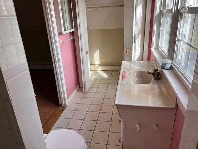 a bathroom with a sink and a large mirror