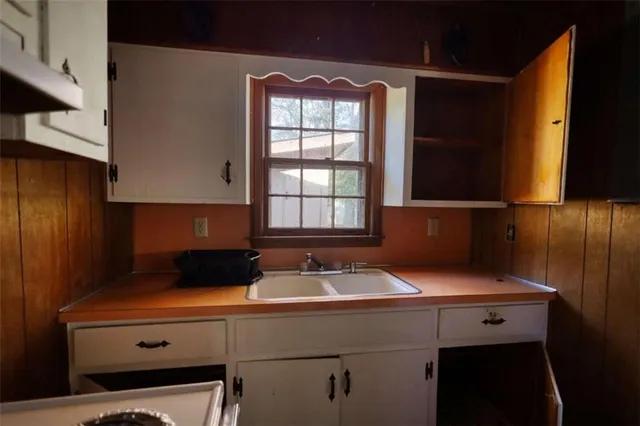 a sink a refrigerator and window