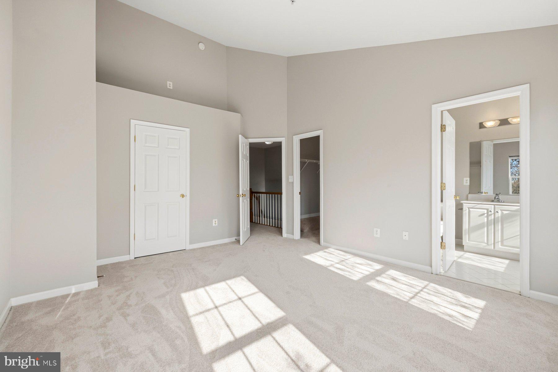 9702 Washingtonian Boulevard Gaithersburg, MD 20878 - Photo 16 of 30 Primary bedroom with two Walking closets