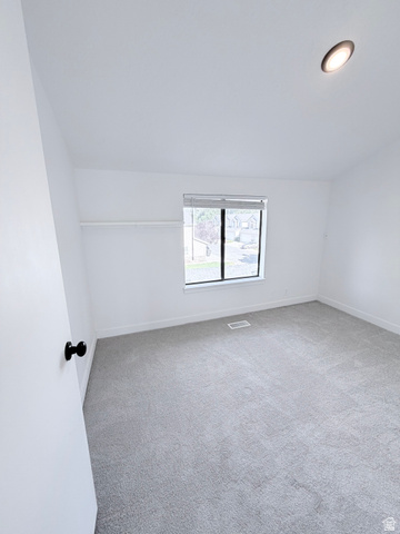 227 South West Lane Provo, UT 84601 - Photo 16 of 25 Carpeted interior space featuring a window with blinds, recessed ceiling lighting, and a closet with a shelf and hanging rod