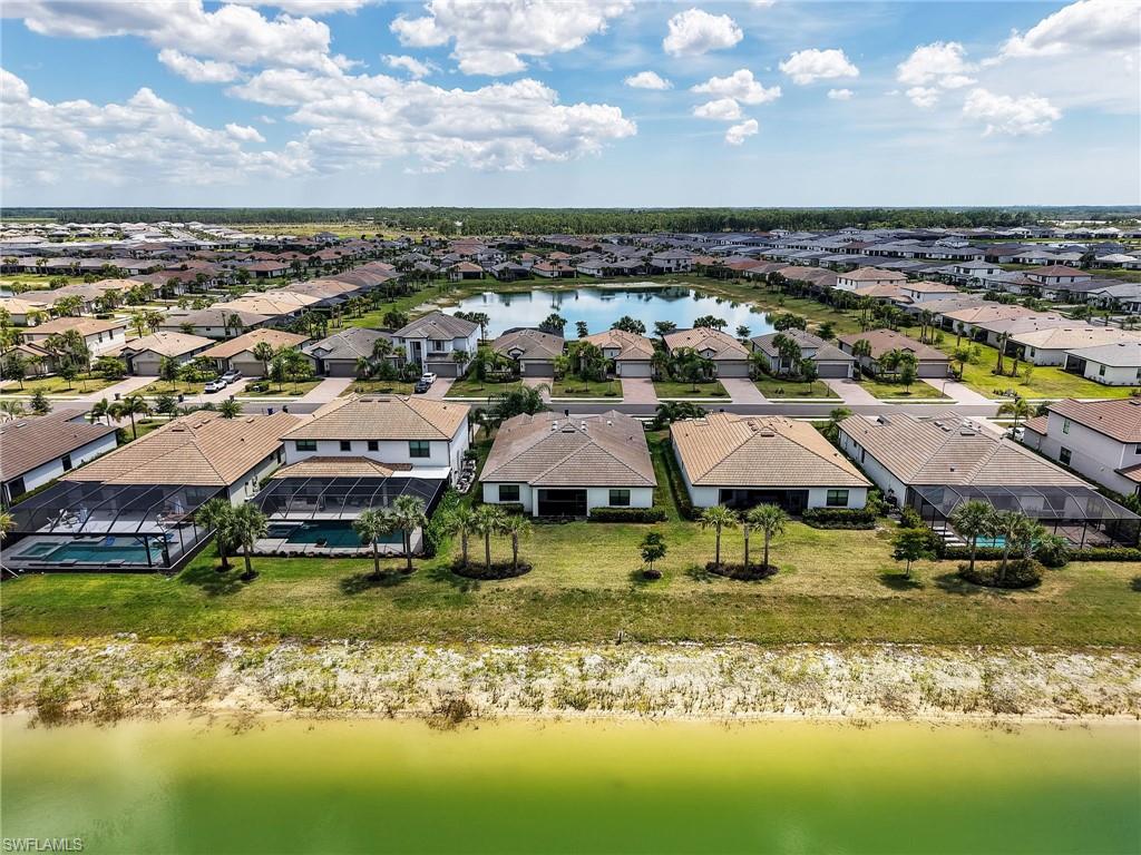 18278 Ridgeline Drive Estero, FL 33928 - Photo 32 of 45 a view of a lake with houses