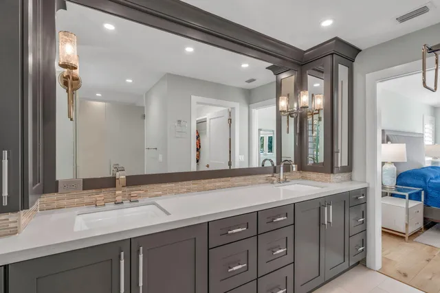 a bathroom with a double vanity sink and a mirror
