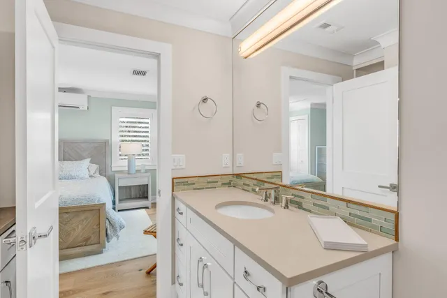 a en suite bathroom with a sink and a mirror