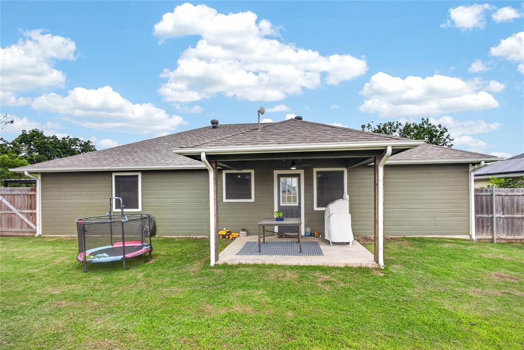 703 College Street Celeste, TX 75423 - Photo 25 of 29 a front view of a house with a garden