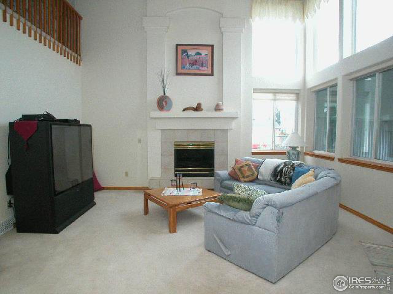 704 Rider Ridge Place Longmont, CO 80504 - Photo 4 of 12 a living room with furniture and a fireplace