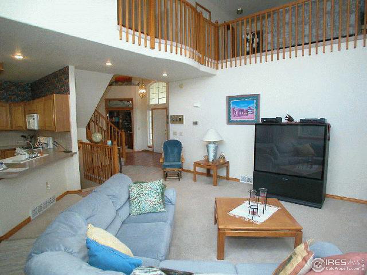 704 Rider Ridge Place Longmont, CO 80504 - Photo 5 of 12 a living room with furniture and a wooden floor