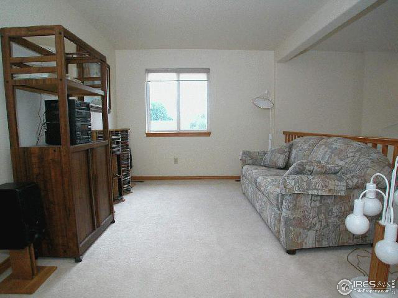 704 Rider Ridge Place Longmont, CO 80504 - Photo 7 of 12 a living room with furniture and wooden floor
