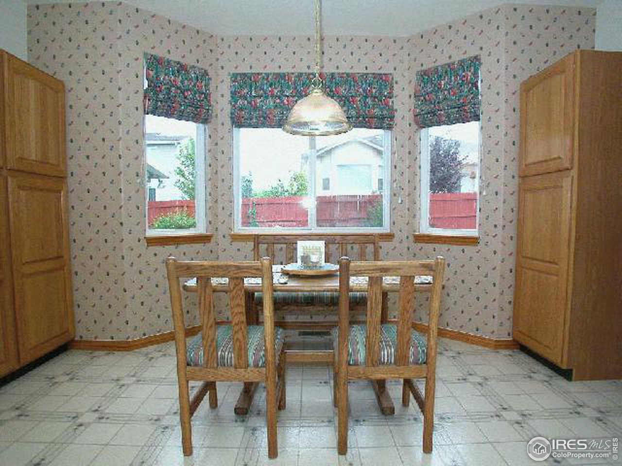 704 Rider Ridge Place Longmont, CO 80504 - Photo 10 of 12 a dining room with furniture and window