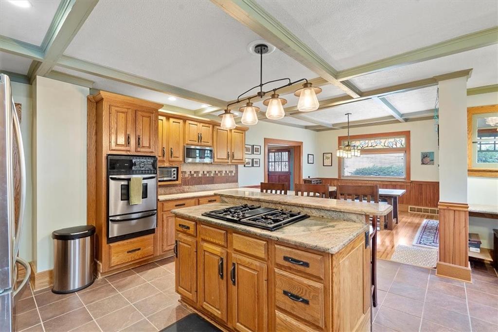 276 Forest Grove Road Coraopolis, PA 15108 - Photo 8 of 25 a kitchen with a stove a sink and a refrigerator