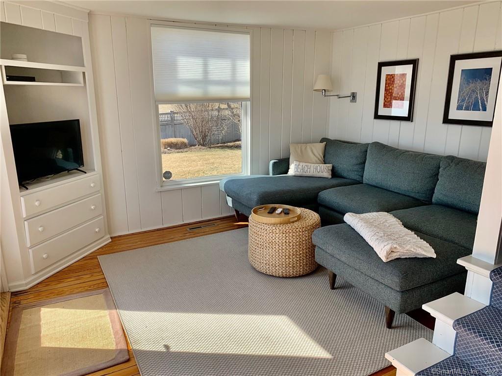 43 Soundview Avenue Madison, CT 06443 - Photo 12 of 31 a living room with furniture and a flat screen tv