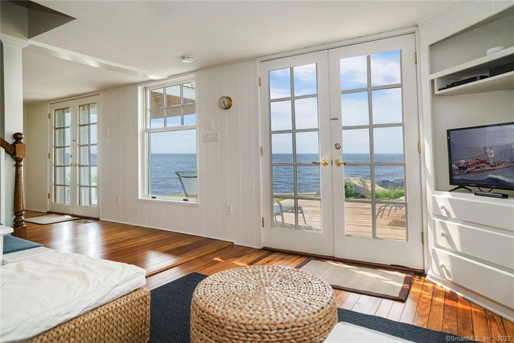 43 Soundview Avenue Madison, CT 06443 - Photo 13 of 31 a bedroom with a bed and wooden floor