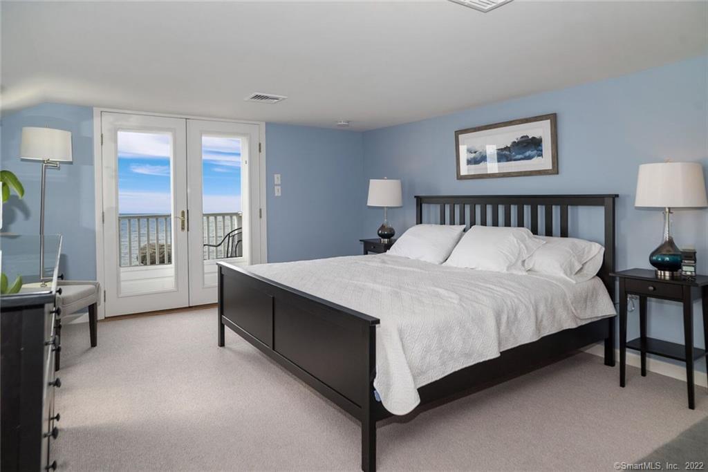 43 Soundview Avenue Madison, CT 06443 - Photo 16 of 31 a large bed sitting in a bedroom next to a window