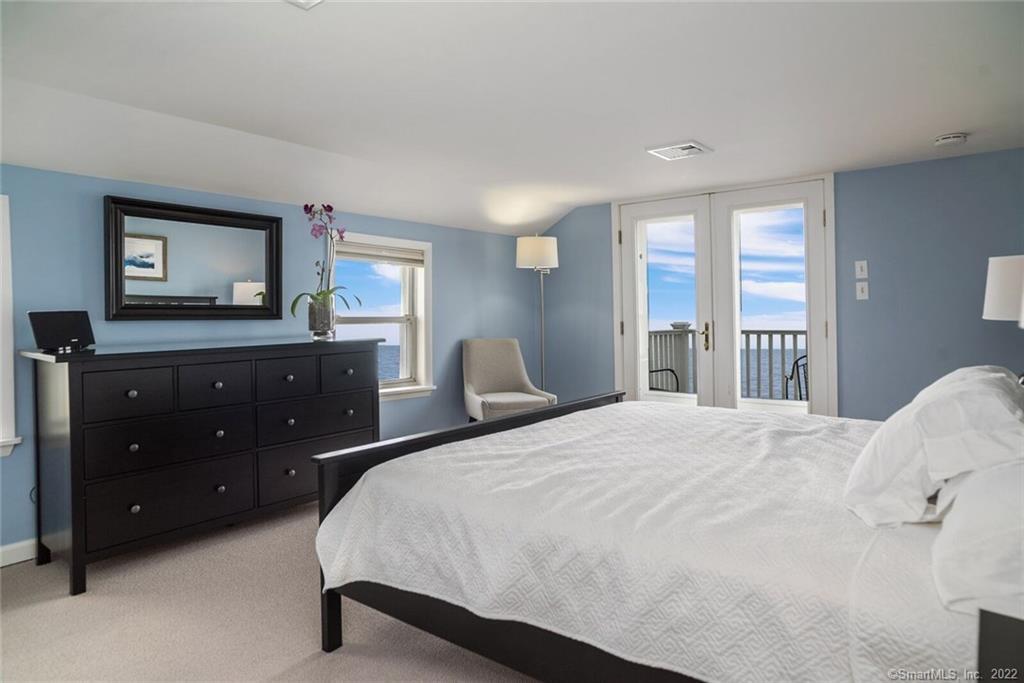 43 Soundview Avenue Madison, CT 06443 - Photo 17 of 31 a bedroom with a bed and a dresser