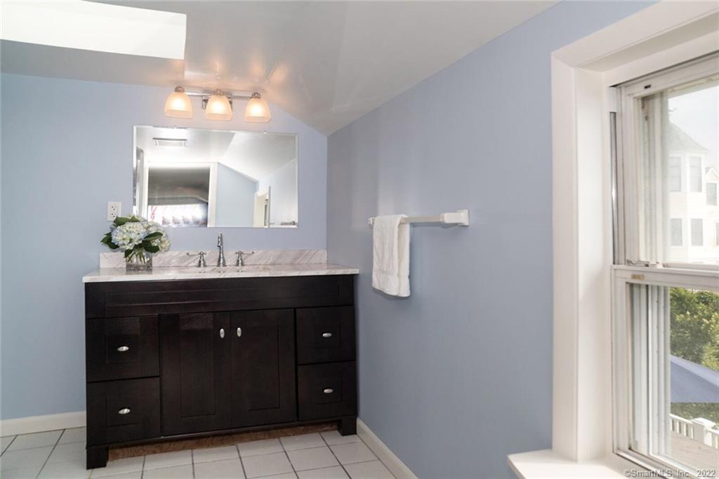 43 Soundview Avenue Madison, CT 06443 - Photo 18 of 31 a bathroom with a sink vanity and mirror
