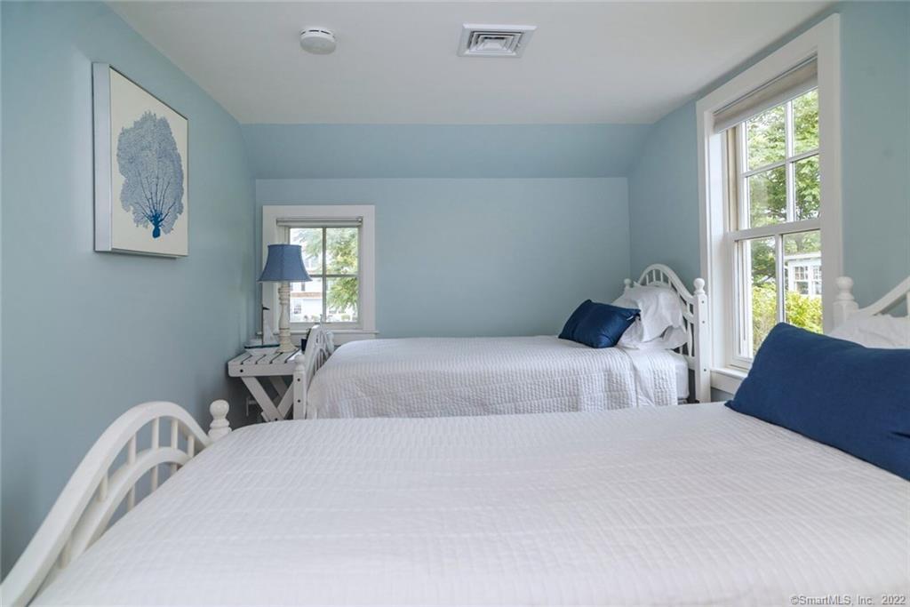 43 Soundview Avenue Madison, CT 06443 - Photo 22 of 31 a bedroom with two beds and a window