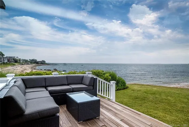 a balcony with furniture and city view