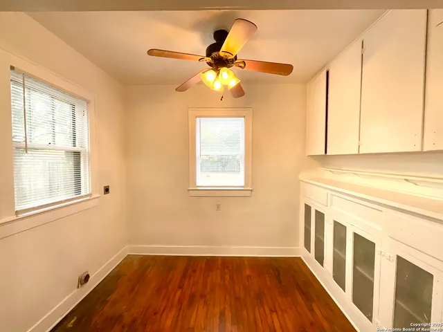 a kitchen with stainless steel appliances granite countertop a refrigerator a stove a sink dishwasher and a refrigerator with wooden floor