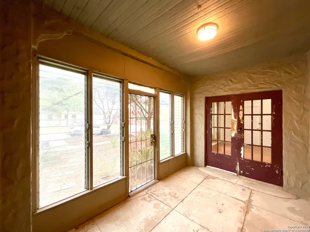 a view of a room with a large window