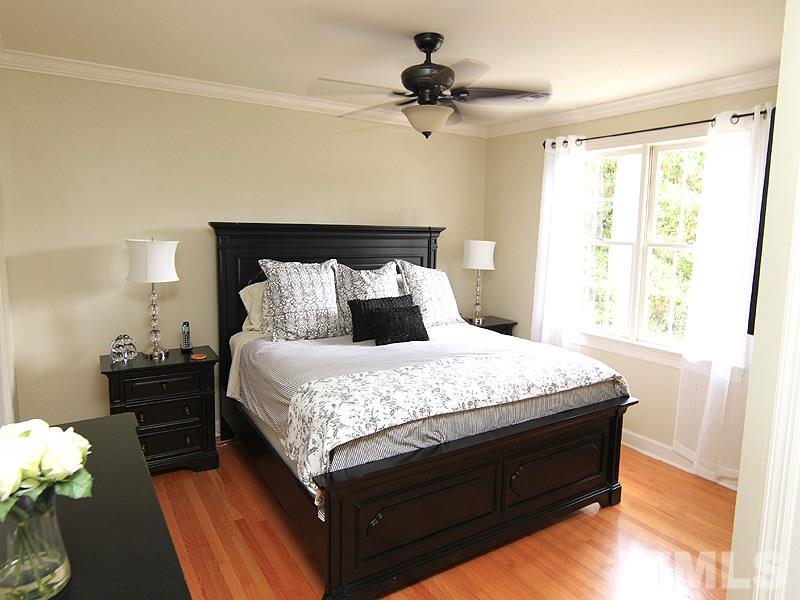 5016 Stonehill Drive Raleigh, NC 27609 - Photo 15 of 22 a bedroom with a bed and window