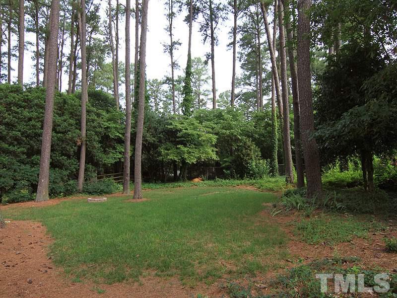 5016 Stonehill Drive Raleigh, NC 27609 - Photo 20 of 22 a view of a trees with a yard