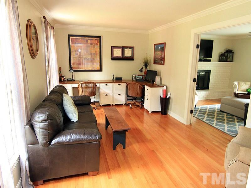 5016 Stonehill Drive Raleigh, NC 27609 - Photo 3 of 22 a living room with furniture and a wooden floor