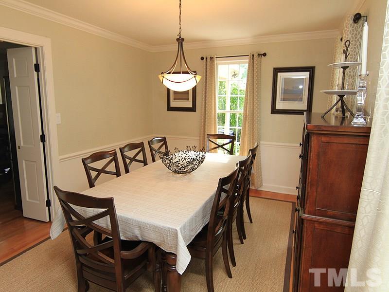 5016 Stonehill Drive Raleigh, NC 27609 - Photo 4 of 22 a view of a dining room with furniture window and wooden floor