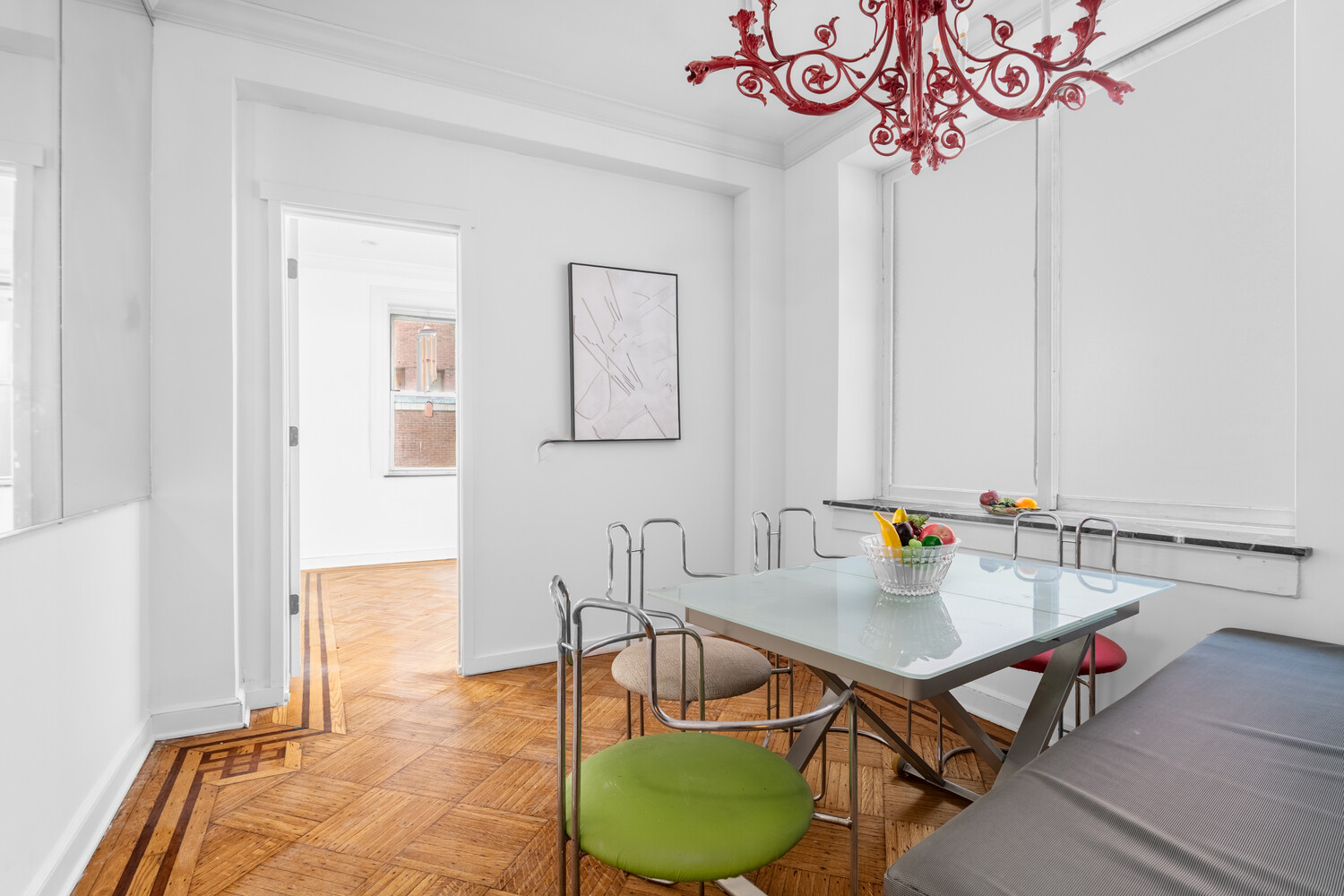 205 West 57th Street, Unit 3DB Manhattan, NY 10019 - Photo 11 of 28 a view of a dining room with furniture and wooden floor
