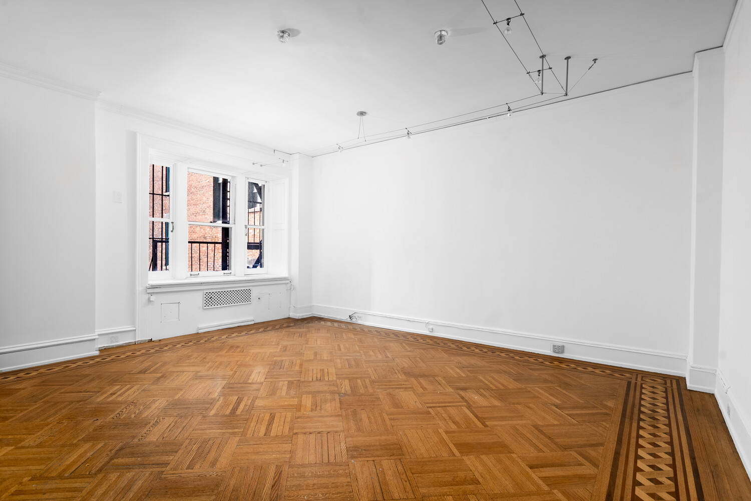 205 West 57th Street, Unit 3DB Manhattan, NY 10019 - Photo 7 of 28 a view of an empty room with window and wooden floor