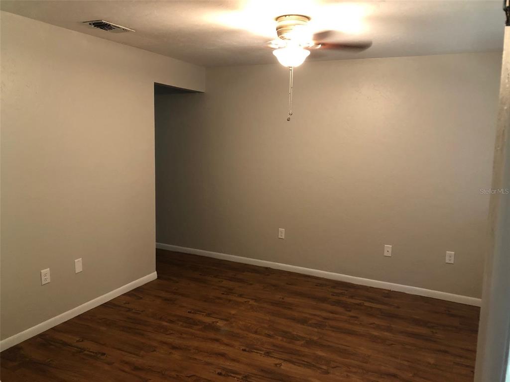 6818 Southwest 42nd Place, Unit D Gainesville, FL 32608 - Photo 2 of 16 a view of a small space with wooden floor