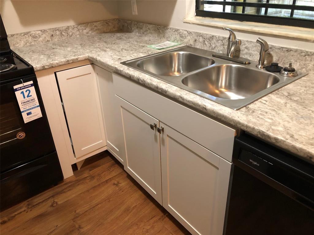 6818 Southwest 42nd Place, Unit D Gainesville, FL 32608 - Photo 7 of 16 a close view of sink and tap