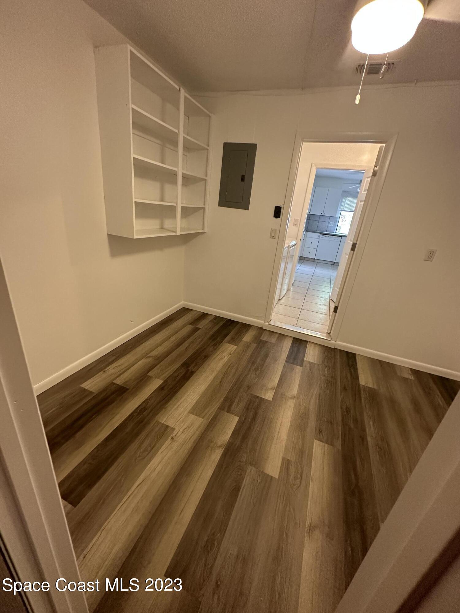 1331 Creel Road Northeast Palm Bay, FL 32905 - Photo 16 of 21 a view of wooden floor and staircase