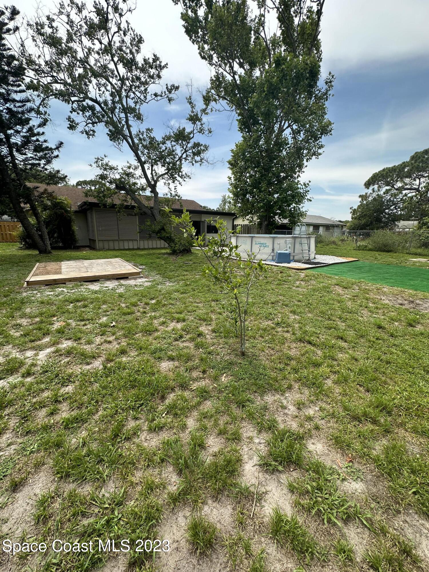 1331 Creel Road Northeast Palm Bay, FL 32905 - Photo 19 of 21 a view of backyard with green space