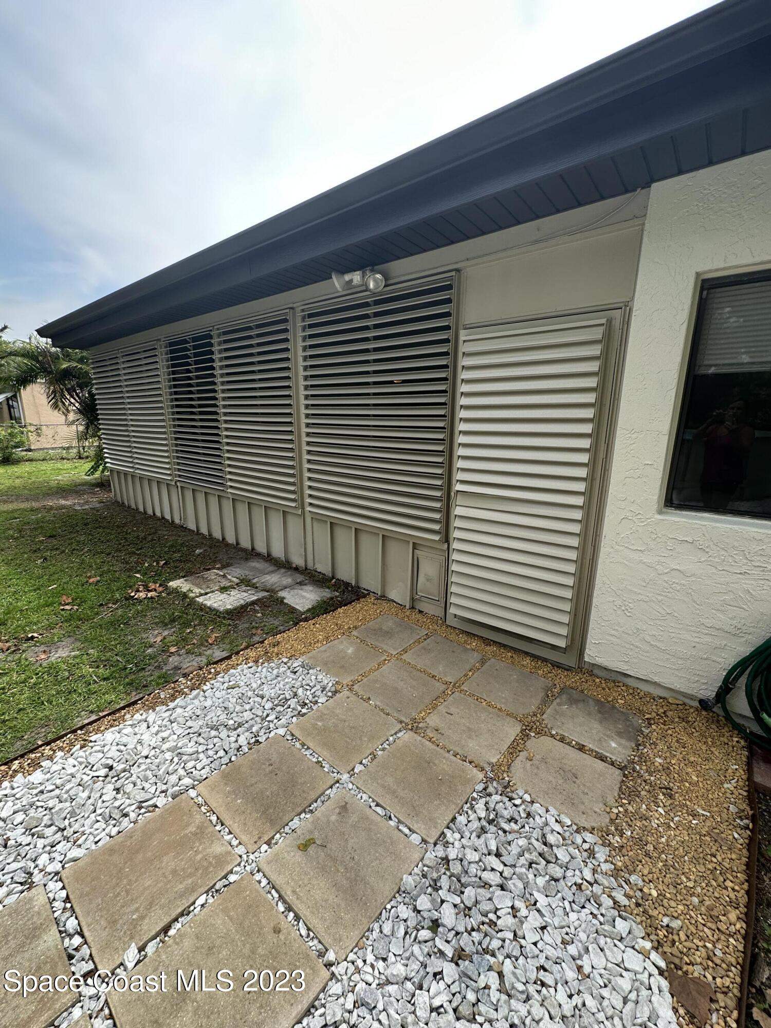 1331 Creel Road Northeast Palm Bay, FL 32905 - Photo 20 of 21 a backyard of a house