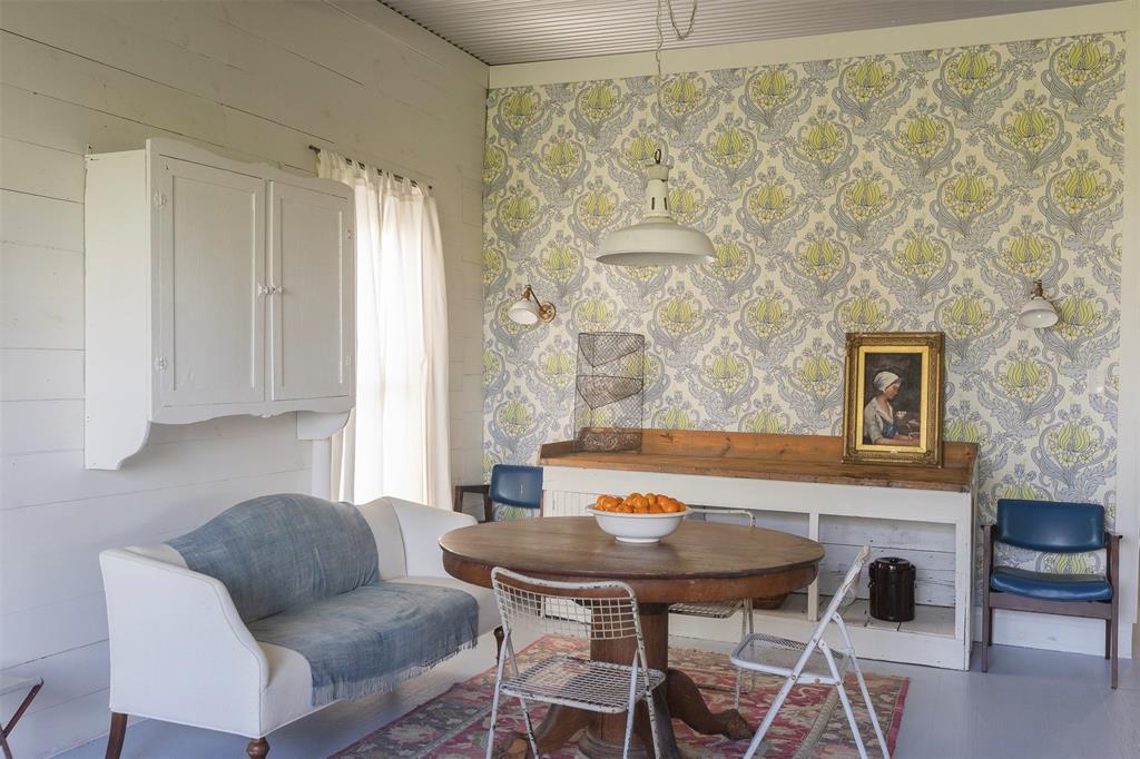 3183 Harrell Road Howe, TX 75459 - Photo 15 of 39 a view of a dining room with furniture and wooden floor
