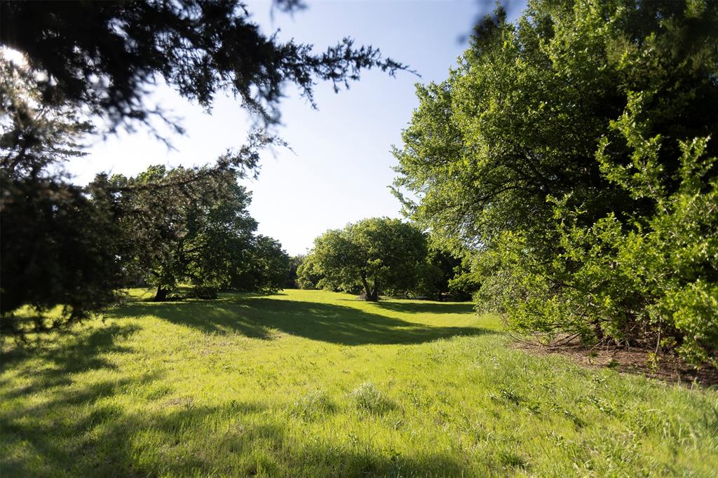 3183 Harrell Road Howe, TX 75459 - Photo 37 of 39 a view of a golf course with a lake