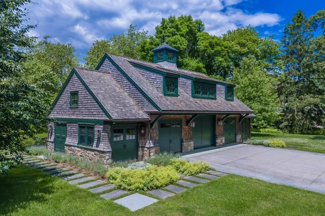 a view of a house with a yard and plants