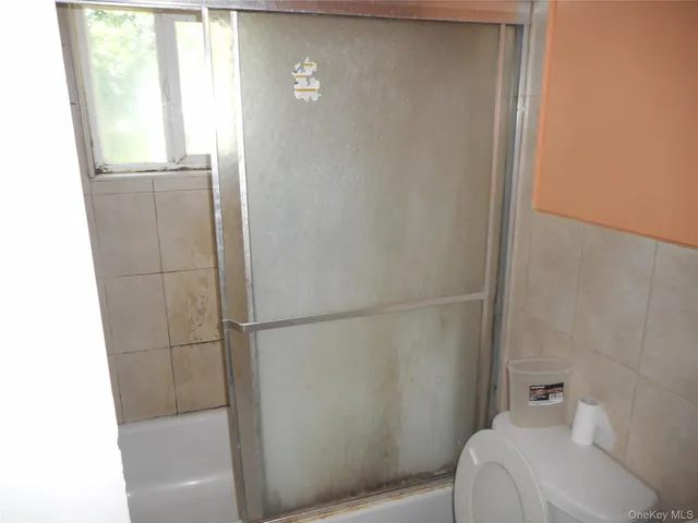 a stove top oven sitting inside of a kitchen